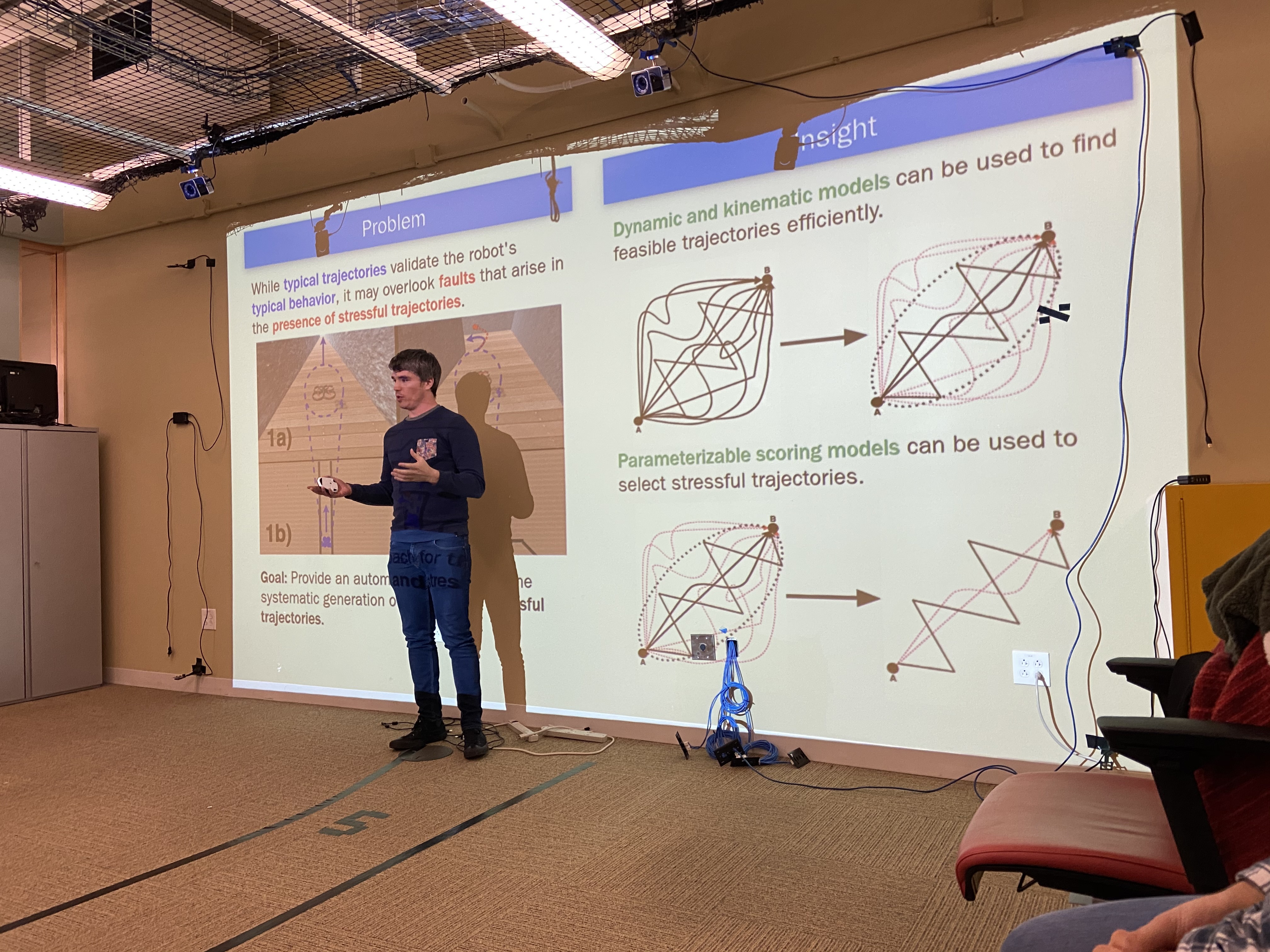 Carl giving a talk on his recently published work on creating stressful trajectories for robots.