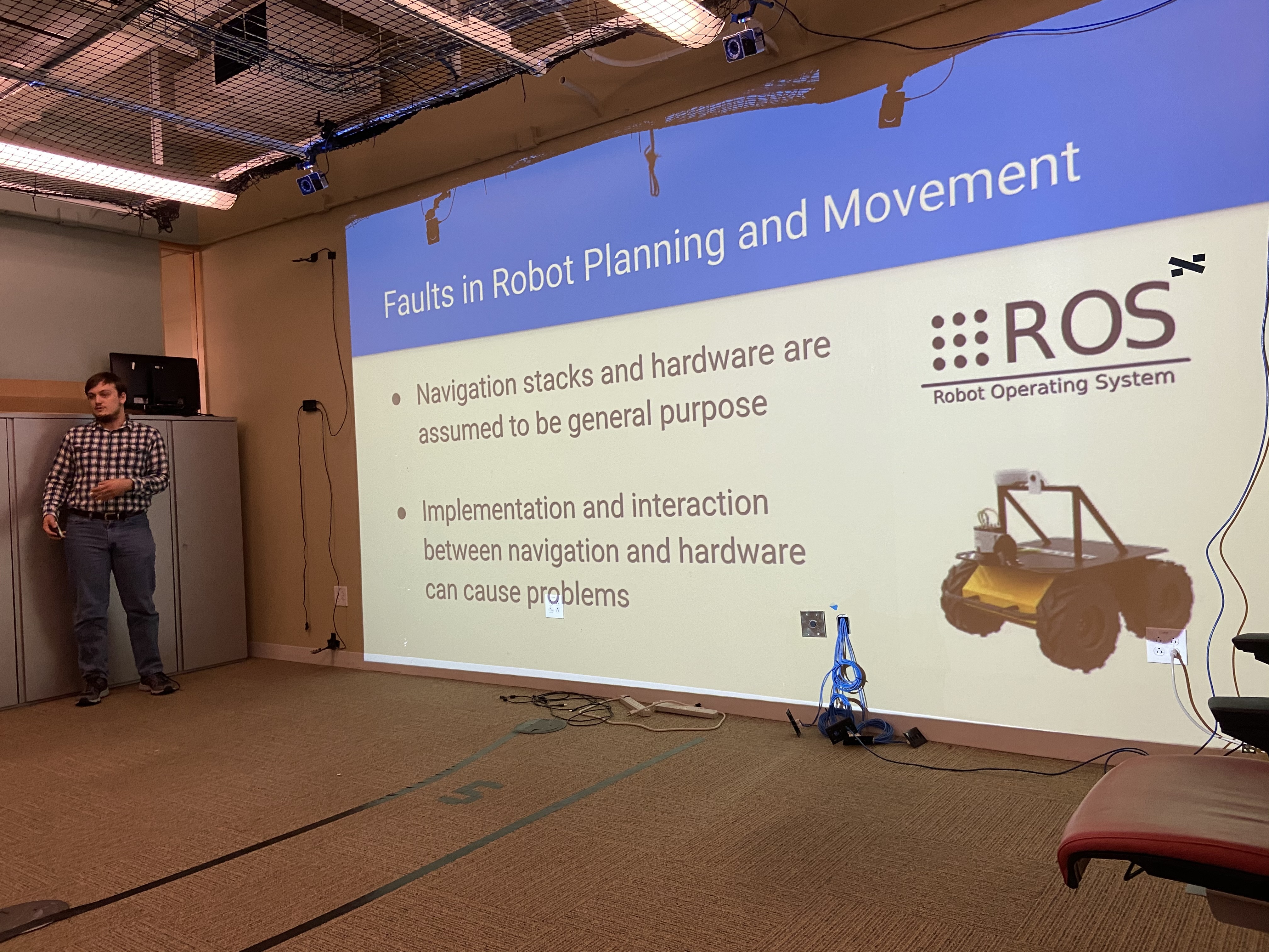 Trey talking about his current work on identifying and predicting faults in robots.